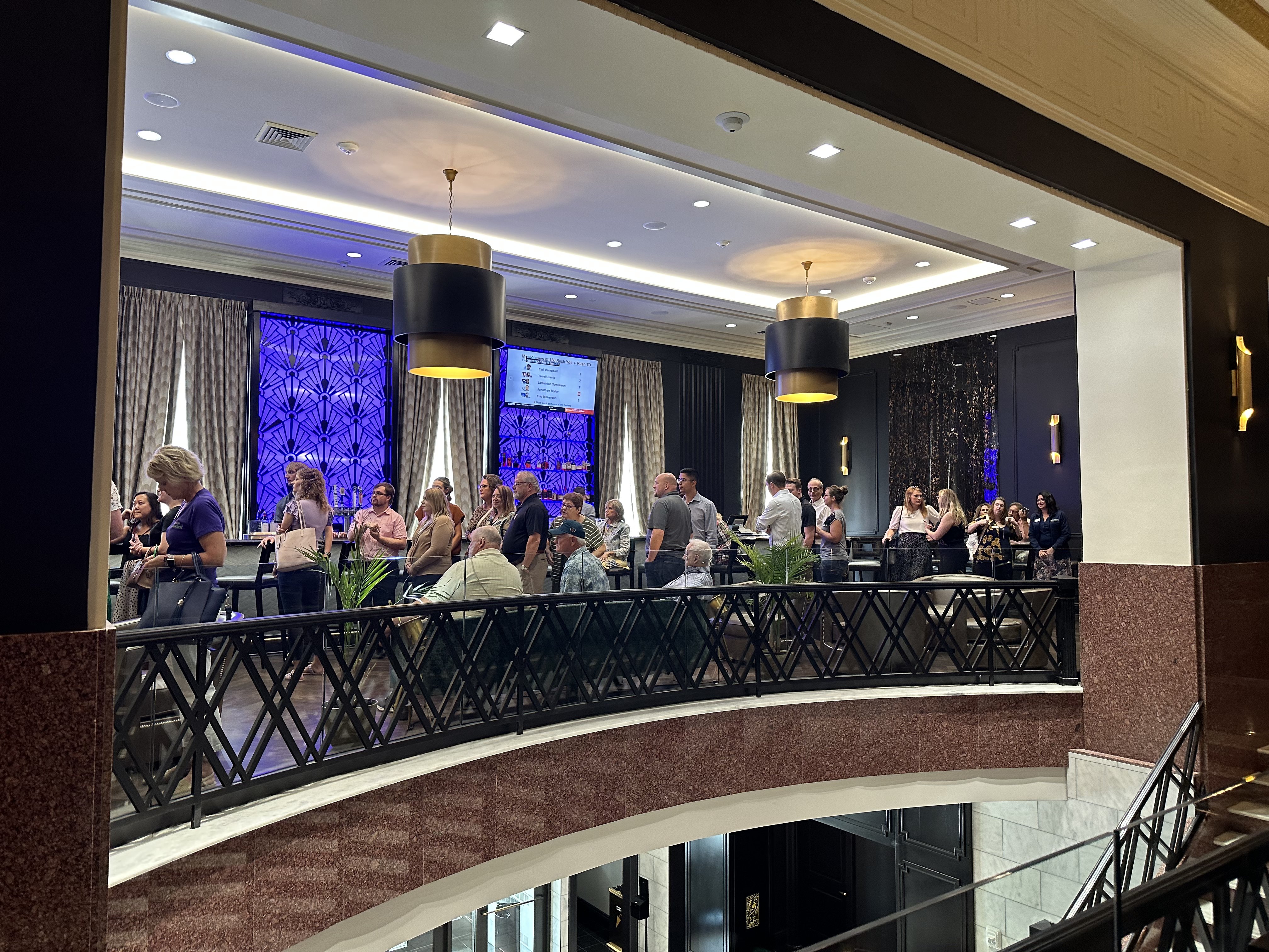 GM spotlighting team with microphone